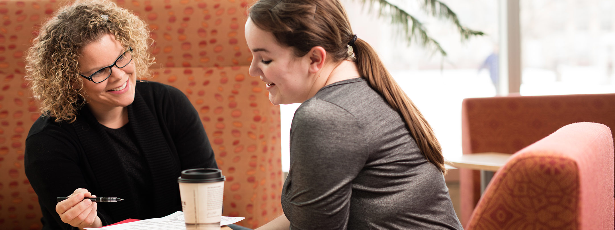 An advisor talks with a student.